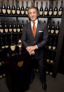 Sylvester Stallone displays his SBIFF Montecito Award and signature bottle of the Dom Perignon Lounge (Photo by Michael Kovac/SBIFF/Dom Perignon)